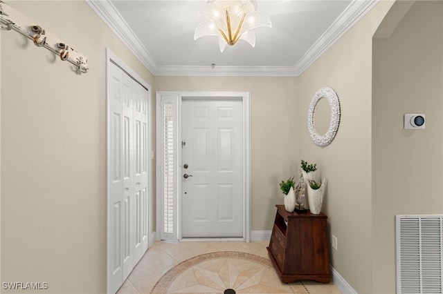 foyer entrance featuring light tile patterned floors and ornamental molding