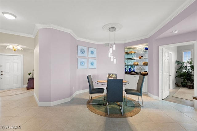 269 Vintage Bay Dr Unit C-13, Marco Island, FL 34145 - dining space featuring light tile patterned floors and ornamental molding