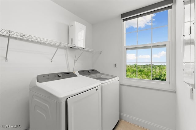 laundry room featuring separate washer and dryer