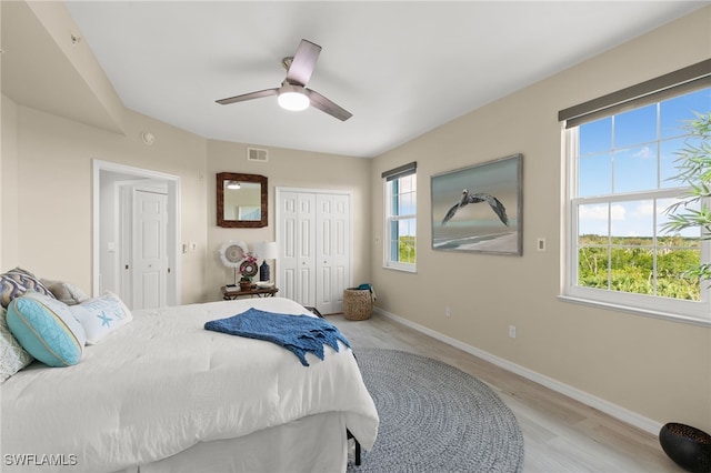 bedroom with ceiling fan and light hardwood / wood-style flooring