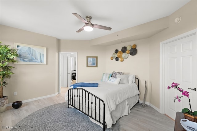 bedroom with ceiling fan and light wood-type flooring