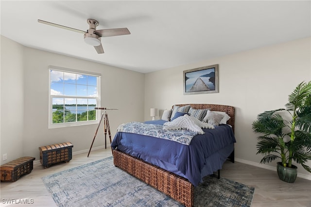 bedroom featuring wood-type flooring and ceiling fan