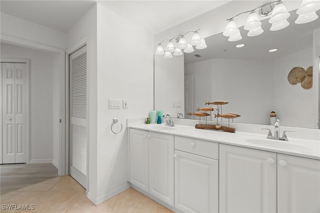 269 Vintage Bay Dr Unit C-13, Marco Island, FL 34145 - bathroom with a closet, double vanity, and tile patterned floors