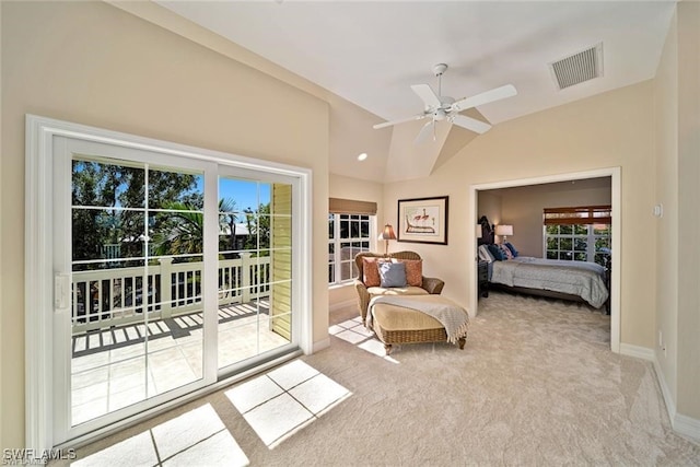 bedroom featuring ceiling fan, vaulted ceiling, access to outside, and multiple windows