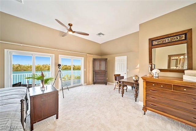 bedroom featuring access to outside, light colored carpet, ceiling fan, a water view, and lofted ceiling