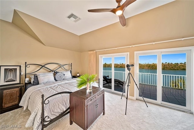 carpeted bedroom featuring access to outside, ceiling fan, a water view, and lofted ceiling