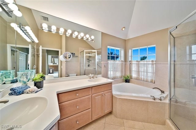 bathroom featuring vanity, separate shower and tub, tile patterned floors, and lofted ceiling