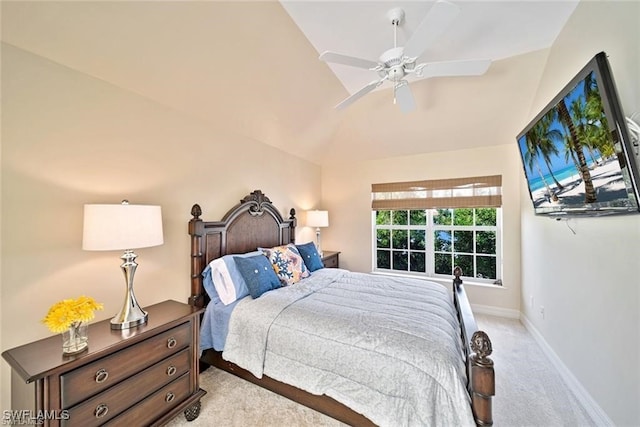 bedroom featuring ceiling fan, light carpet, and vaulted ceiling