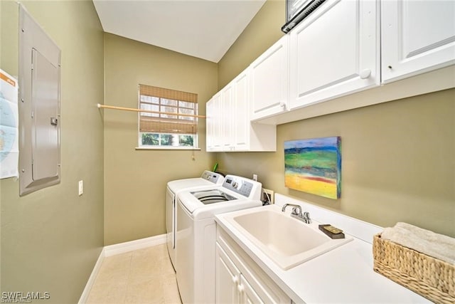 laundry room featuring sink, cabinets, separate washer and dryer, electric panel, and light tile patterned floors