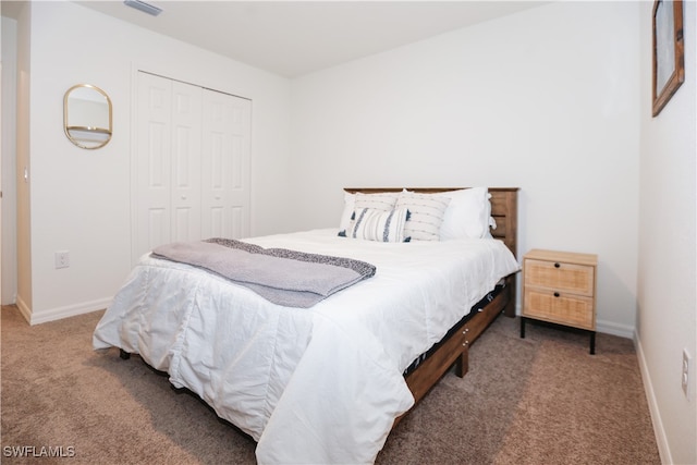 bedroom with carpet floors and a closet