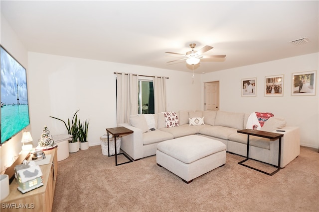 living room with light carpet and ceiling fan