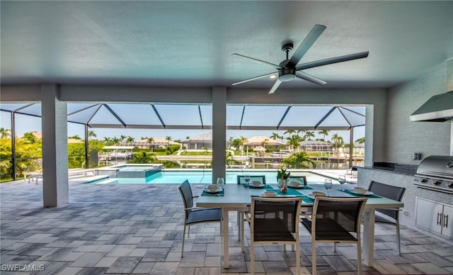 view of patio featuring glass enclosure, area for grilling, and a swimming pool with hot tub