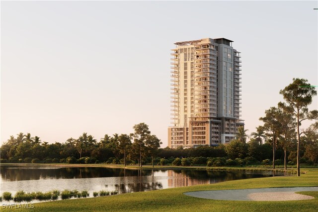 view of home's community featuring a water view and a yard