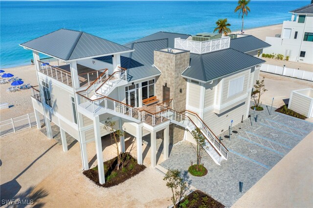 bird's eye view featuring a view of the beach and a water view