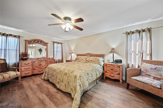 bedroom with ceiling fan and wood-type flooring