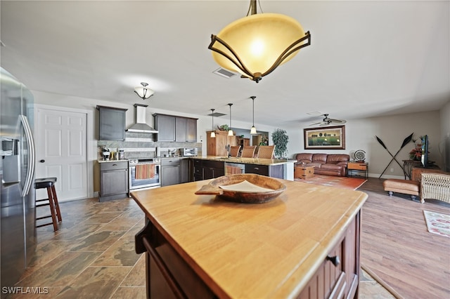 dining area featuring ceiling fan and sink