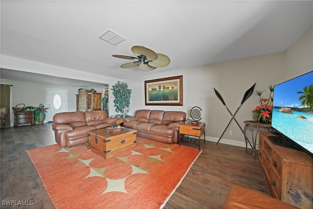 living room featuring dark hardwood / wood-style flooring and ceiling fan