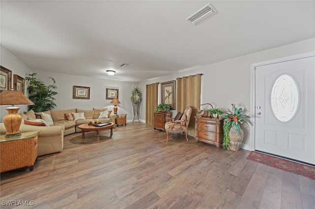 living room with light hardwood / wood-style flooring