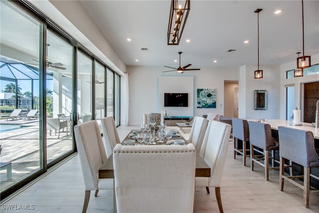 dining space with plenty of natural light and light wood-type flooring