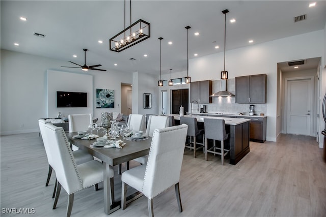 dining room featuring light wood-type flooring and ceiling fan