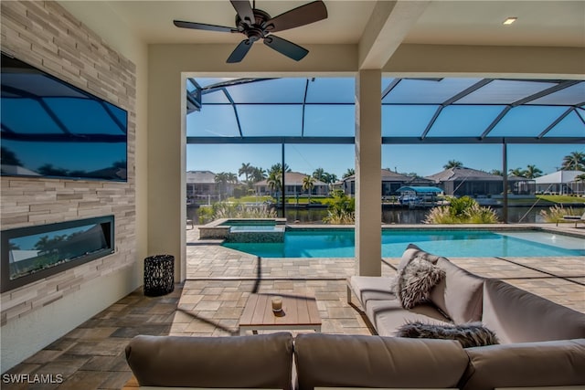 view of swimming pool with a water view, an outdoor hangout area, ceiling fan, an in ground hot tub, and a patio area