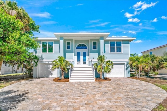 view of front of property with covered porch and a garage