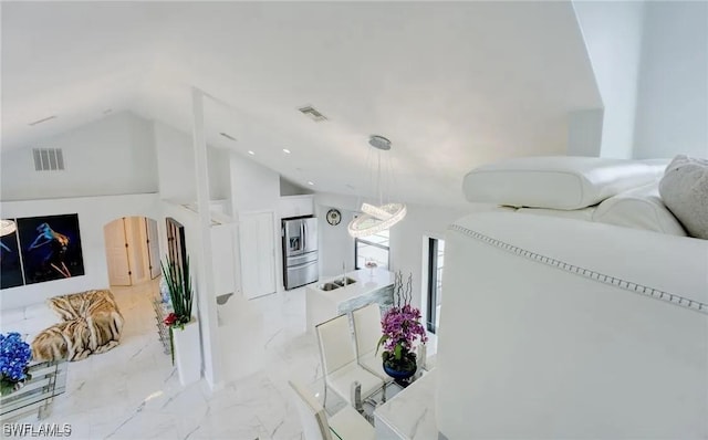 living room featuring vaulted ceiling