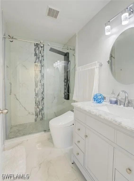 bathroom with walk in shower, vanity, and toilet