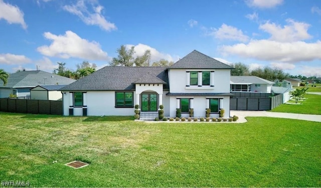 rear view of property featuring a yard