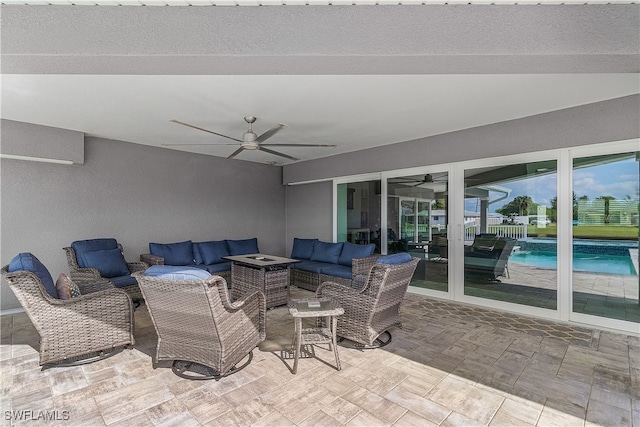 view of patio featuring ceiling fan and an outdoor hangout area