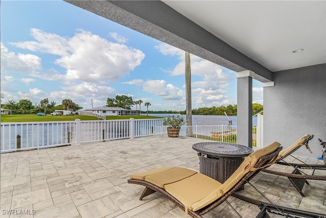 view of patio / terrace with a water view