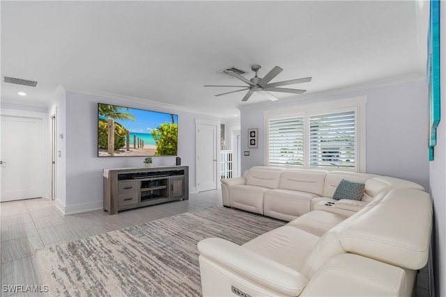 living room with ceiling fan and ornamental molding