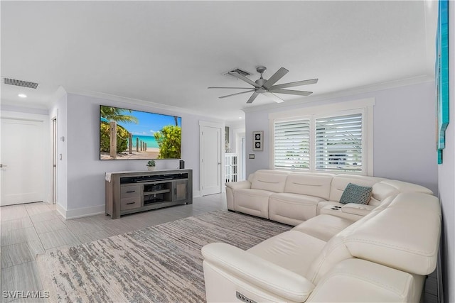 living room with ornamental molding and ceiling fan