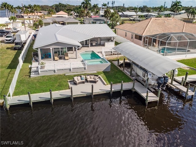 dock area featuring a patio, an outdoor living space, glass enclosure, a fenced in pool, and a water view