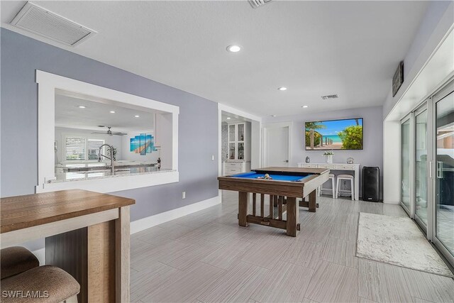 recreation room with ceiling fan and billiards