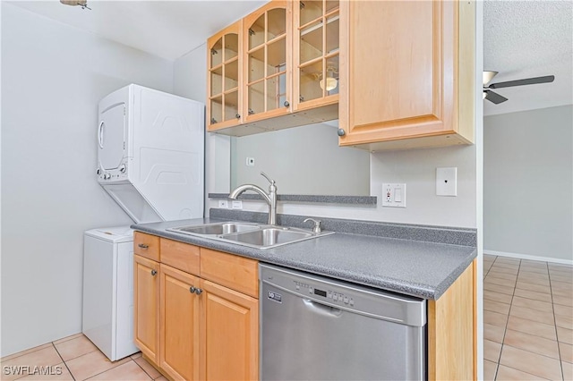 kitchen featuring sink, light tile patterned floors, dishwasher, ceiling fan, and a textured ceiling