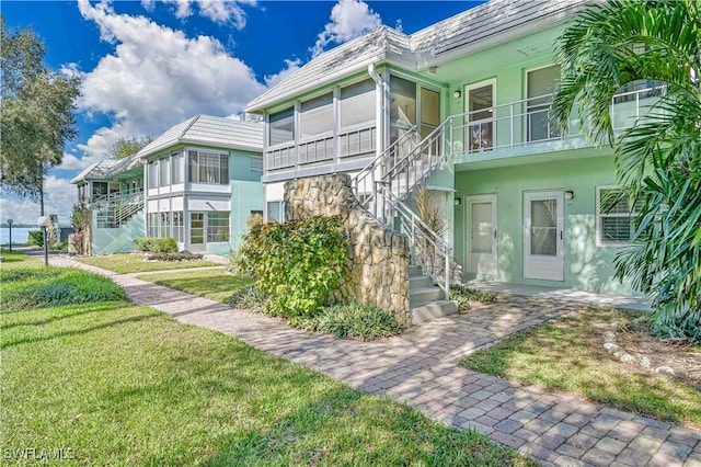 exterior space featuring a front yard