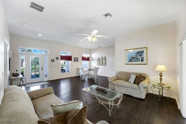 living room with ceiling fan and dark hardwood / wood-style floors