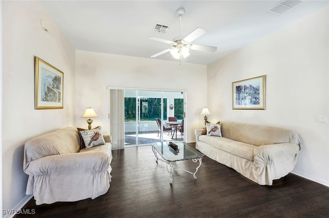 living room with ceiling fan and dark hardwood / wood-style floors