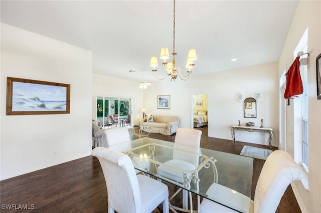 dining area featuring ceiling fan with notable chandelier and dark hardwood / wood-style floors