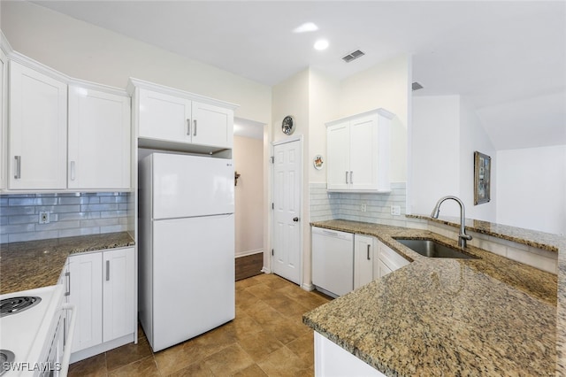 kitchen with backsplash, white cabinetry, white appliances, and sink