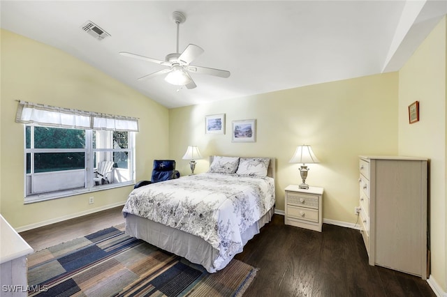 bedroom featuring ceiling fan, dark hardwood / wood-style flooring, and vaulted ceiling