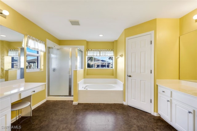 bathroom with vanity and independent shower and bath