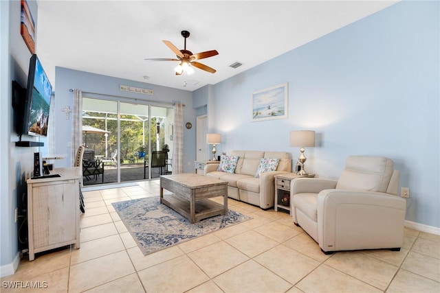 tiled living room featuring ceiling fan