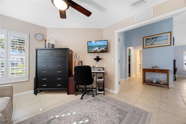 tiled office with vaulted ceiling and ceiling fan