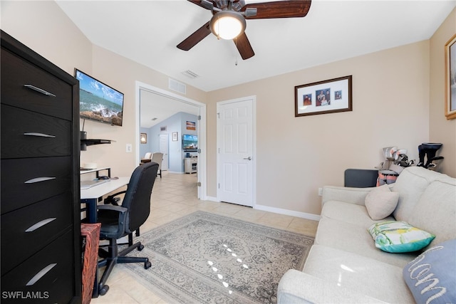 tiled office featuring ceiling fan