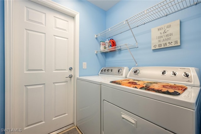 laundry area with independent washer and dryer