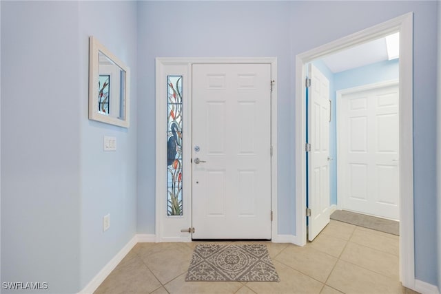 entryway with light tile patterned floors