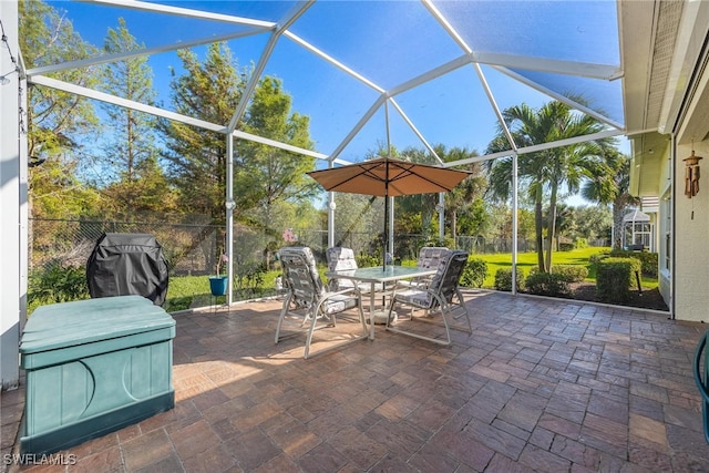 view of patio / terrace with a lanai and grilling area