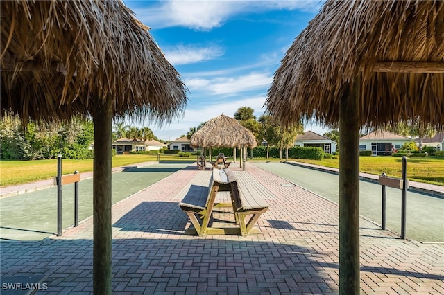 view of community with a lawn and a gazebo